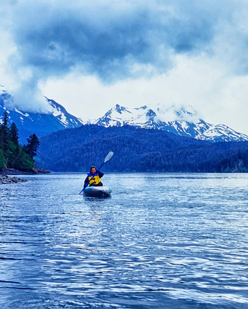 a person kayaking in remote Alaskan waters