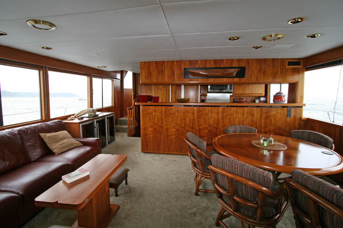 the interior dining area of a small, luxury cruise ship